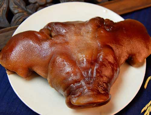 腊猪头加工技术_岳阳蝶式腊猪头制作方法